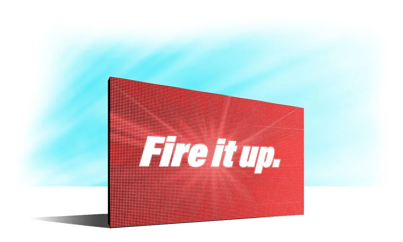 A red rectangular digital sign with the words “Fire it up.” in bold white letters stands against a light blue sky with a few wispy clouds.