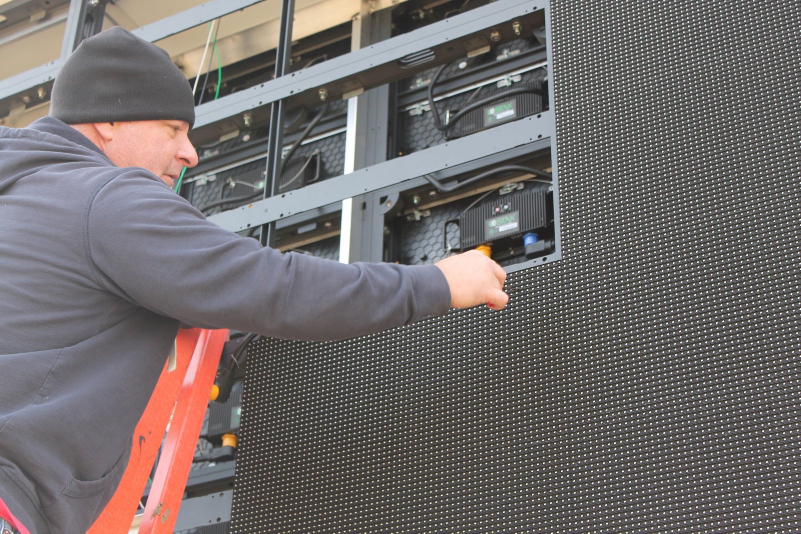 Technician working on LED display modules at Kansas Lighting in Wichita, Kansas.