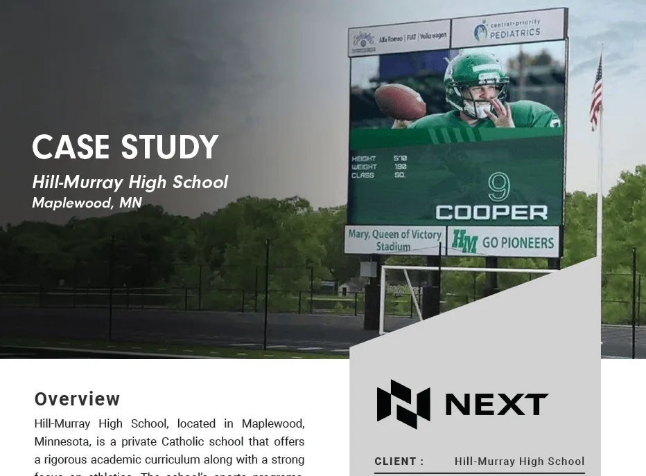 A high-brightness LED electronic message center at Hill-Murray High School’s football field displays a uniformed player. The solid-state scoreboard, set against a backdrop of trees, features text referencing a case study for the school.