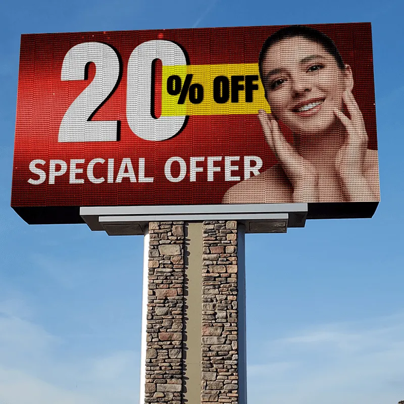An LED electronic message center showcases "20% OFF SPECIAL OFFER" alongside a smiling woman against a vibrant red background, set on an aluminum frame with blue sky in the background.