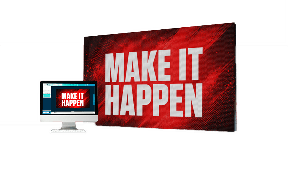 A computer monitor presents a slide reading MAKE IT HAPPEN in bold white letters on a red background, mirroring a larger high-brightness LED sign or electronic message center behind it that displays the same text.